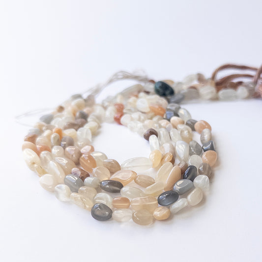 Multi Moonstone smooth tumble gemstone beads in 6–7mm size on a 32cm strand for DIY jewellery.