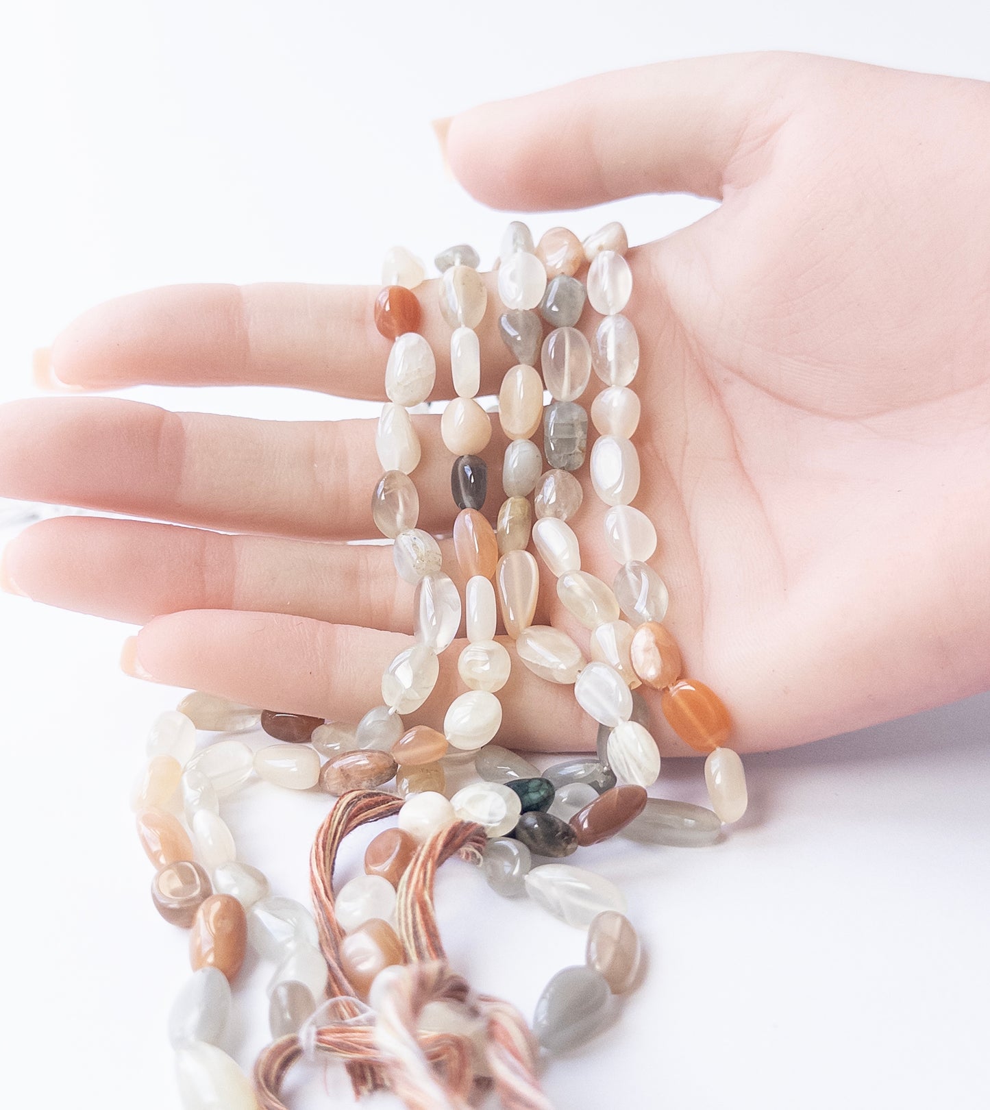 Smooth tumble Multi Moonstone beads showcasing natural shimmer for DIY gemstone jewellery designs.