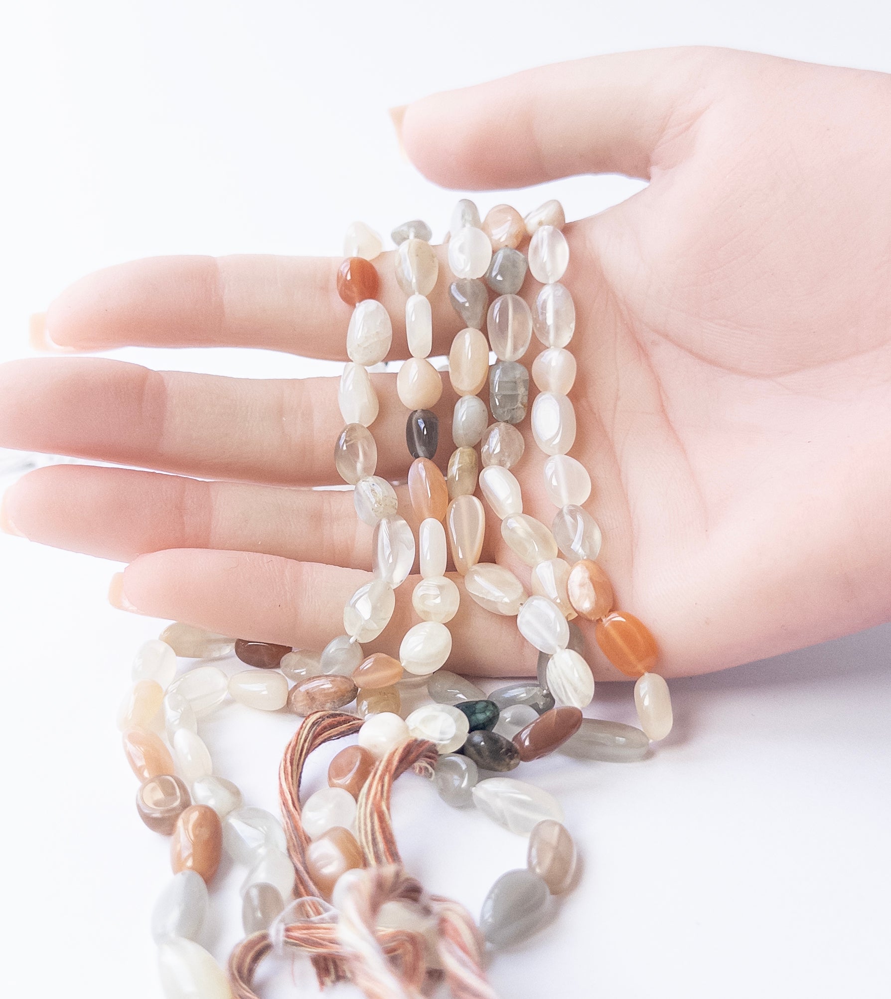 Smooth tumble Multi Moonstone beads showcasing natural shimmer for DIY gemstone jewellery designs.