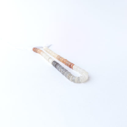 Multi Moonstone smooth wheel gemstone beads in soft neutral tones, ideal for genuine stone bead jewellery making.