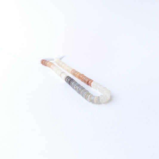 Multi Moonstone smooth wheel gemstone beads in soft neutral tones, ideal for genuine stone bead jewellery making.
