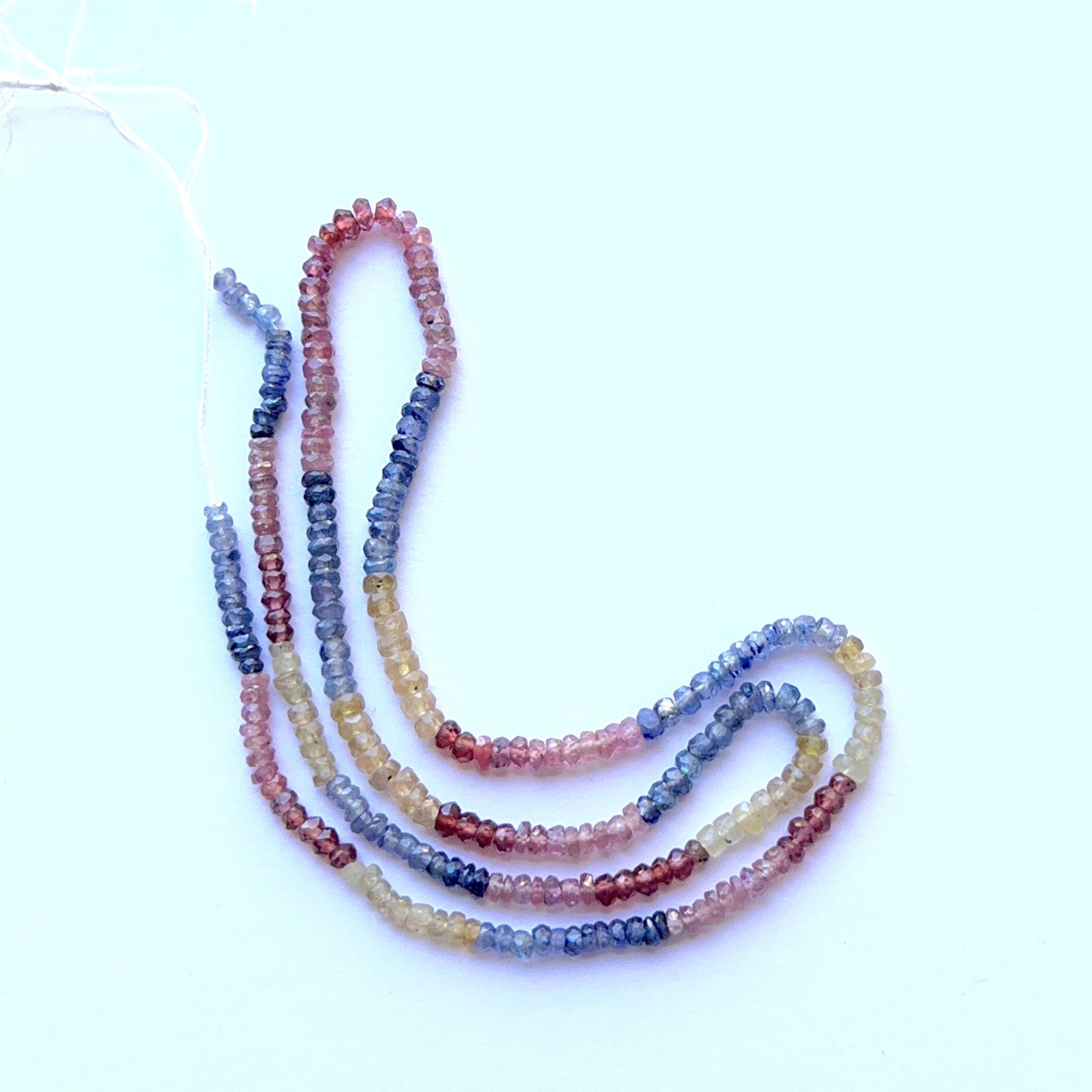 Multi‑precious faceted rondelle strand with ruby, yellow sapphire and blue sapphire 2.8–3.2mm on a 36cm or 41cm strand, vivid colour and sparkle.