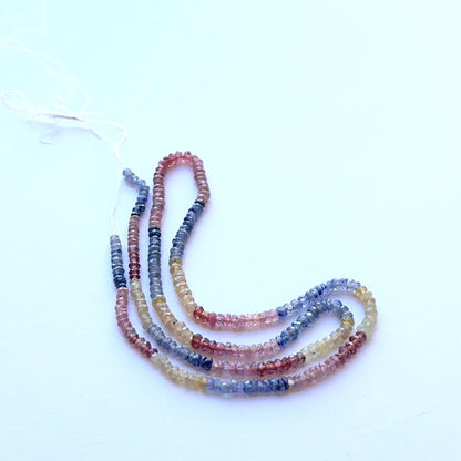 Strand of ruby, yellow sapphire and blue sapphire faceted rondelle 2.8–3.2mm ideal for layered necklaces and artisan DIY jewellery projects.

