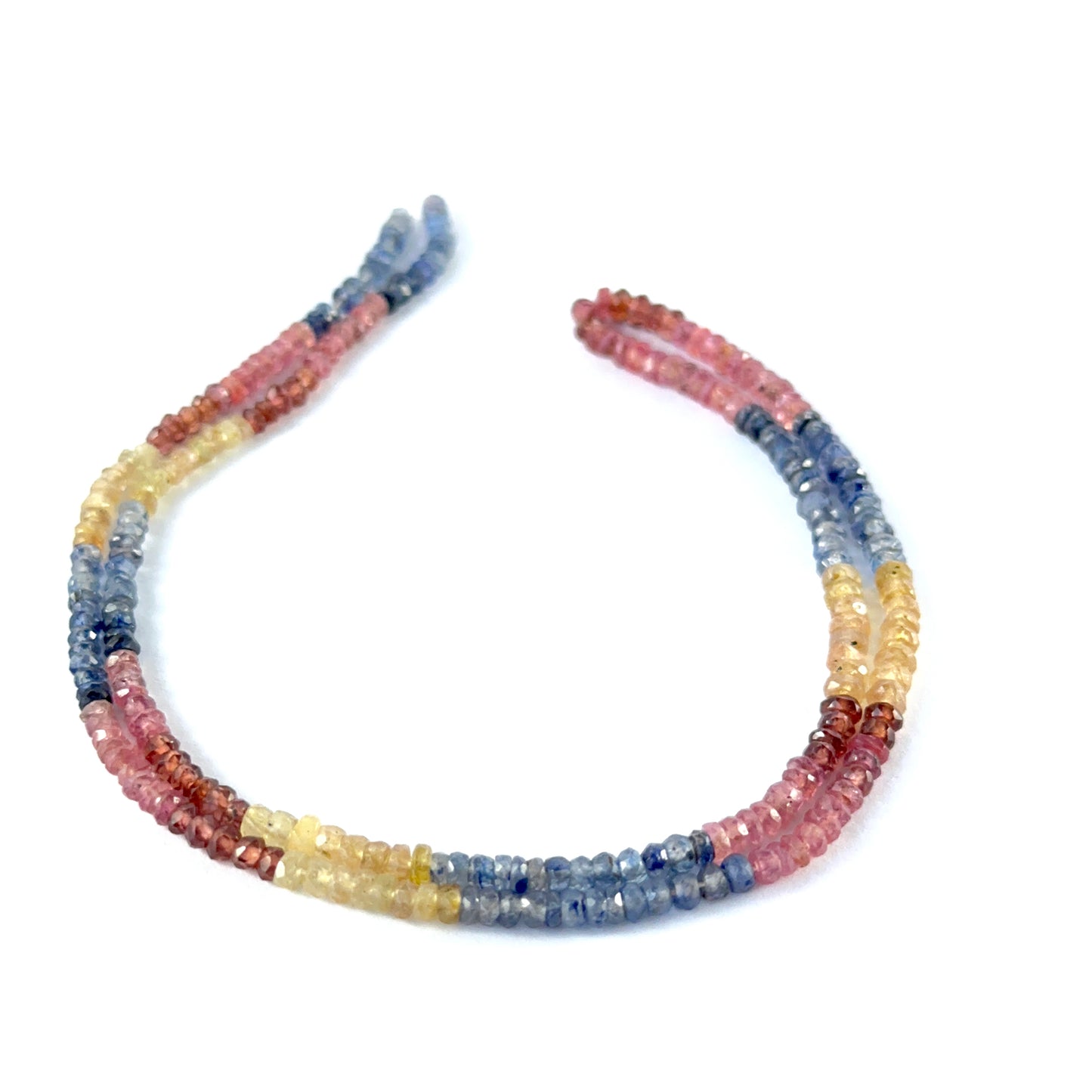 Faceted rondelle Multi Precious gemstone beads arranged neatly, highlighting their polished finish and handmade jewellery quality.