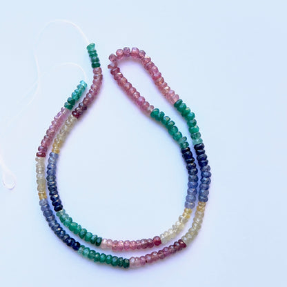 Strand of ruby, yellow sapphire, blue sapphire and emerald faceted rondelle beads 3.3–4mm ideal for layered necklaces and DIY jewellery.

