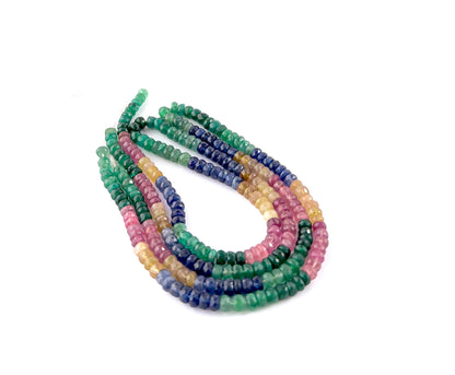 Close‑up of multi precious faceted rondelle beads highlighting their reflective facets and vibrant gemstone palette.