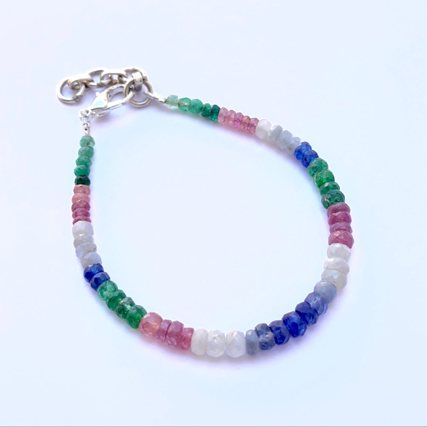 Gemstone bracelet with faceted rondelles showing bright colour and shine.