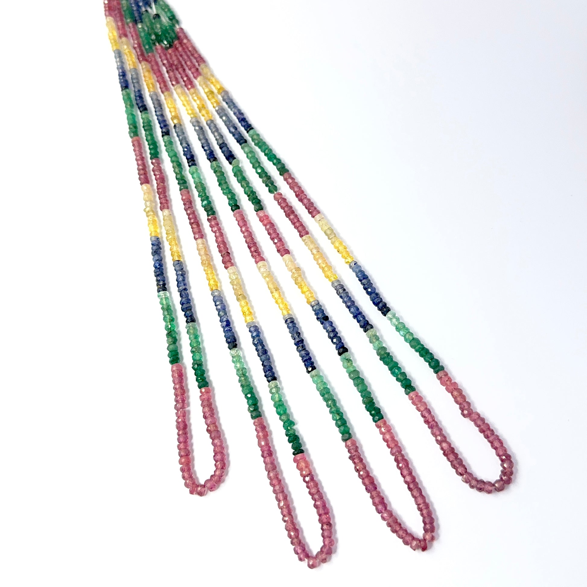 Detailed 2.8–3.5mm multi precious rondelles showing vibrant red, blue, yellow and green hues for DIY jewellery making.