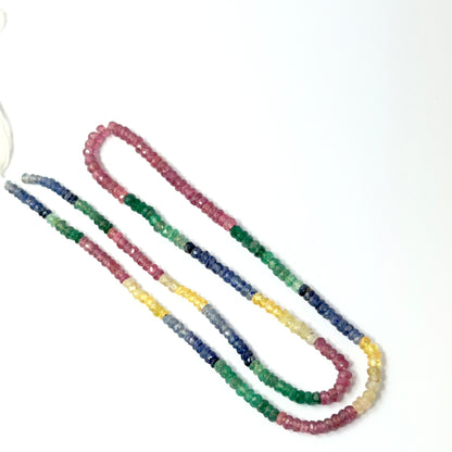 Multi precious faceted rondelles aligned on a strand, highlighting clarity, colour mix and quality stone beads.