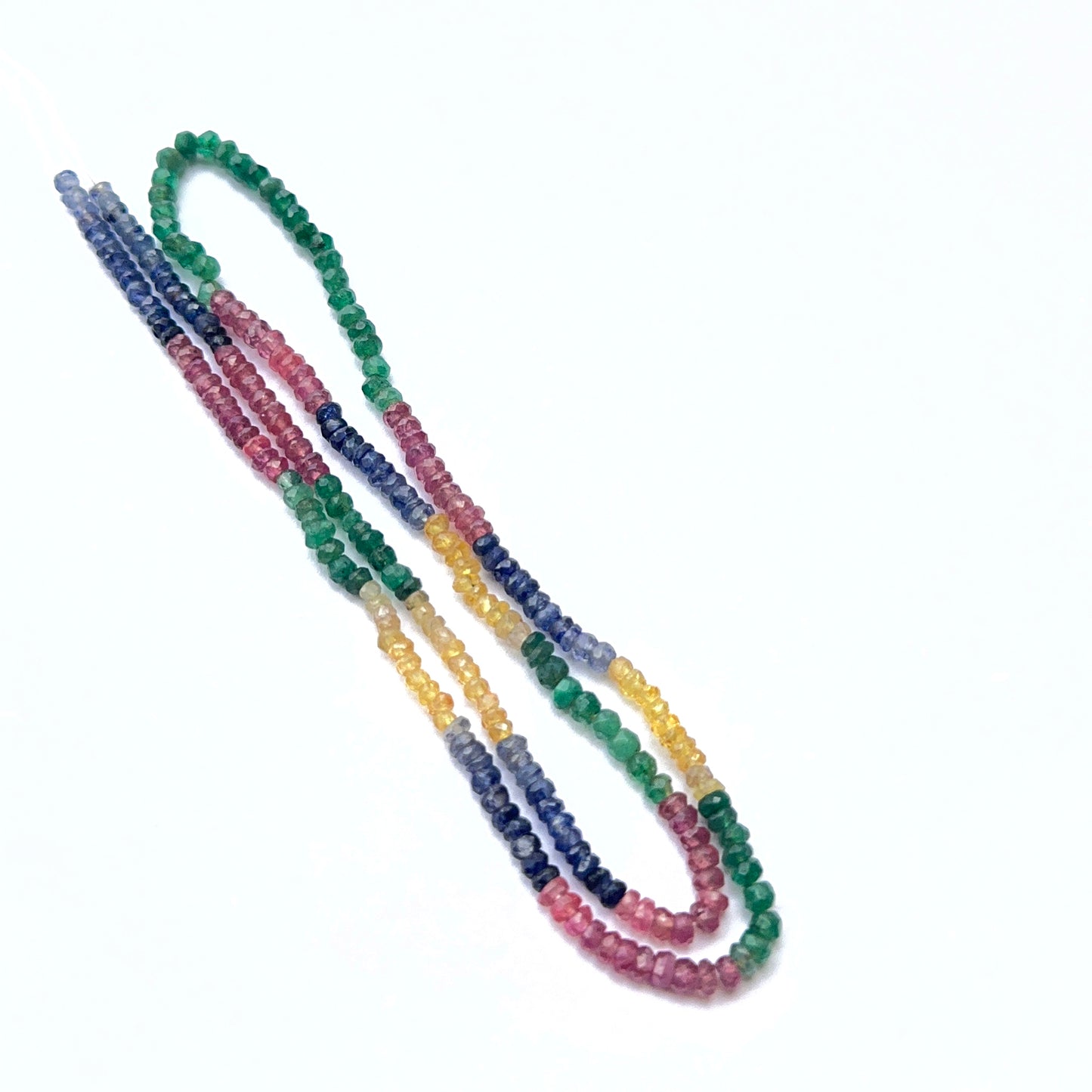 Colourful gemstone strand featuring sparkling faceted rondelles in mixed precious stones.