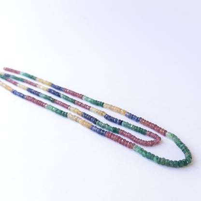 Close‑up of Multi Precious faceted rondelle beads revealing clarity, shine and fine craftsmanship.