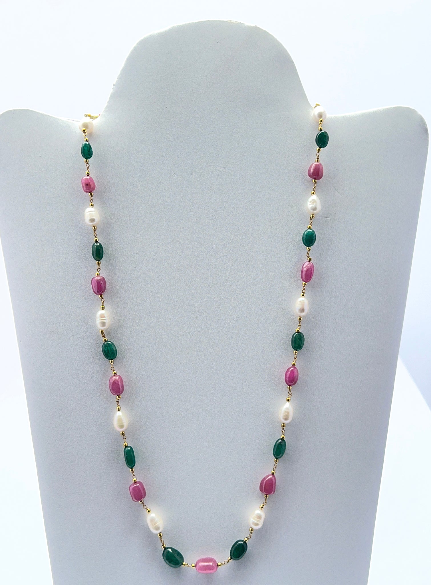 Multi precious necklace featuring smooth tumble ruby, emerald and pearl beads in a vibrant design.