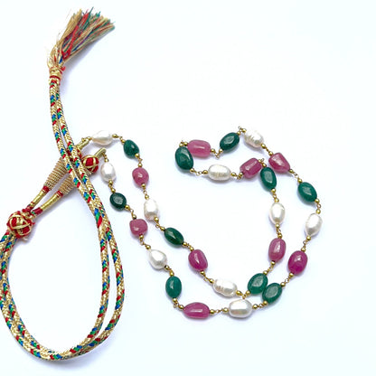 Colourful gemstone necklace with polished tumble beads showing shine and variation.