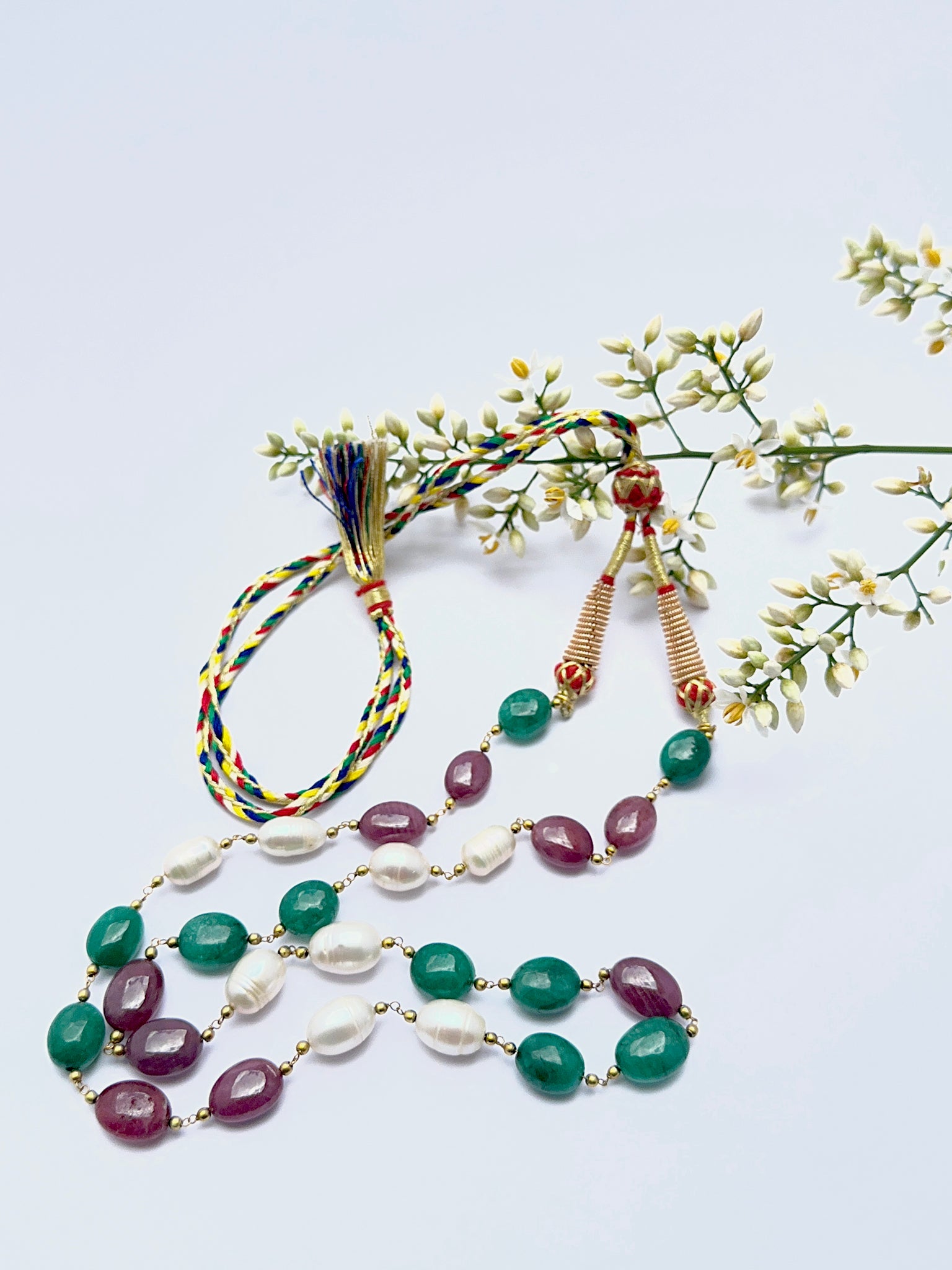 Elegant gemstone necklace featuring large oval beads in a bold multi‑gem design.