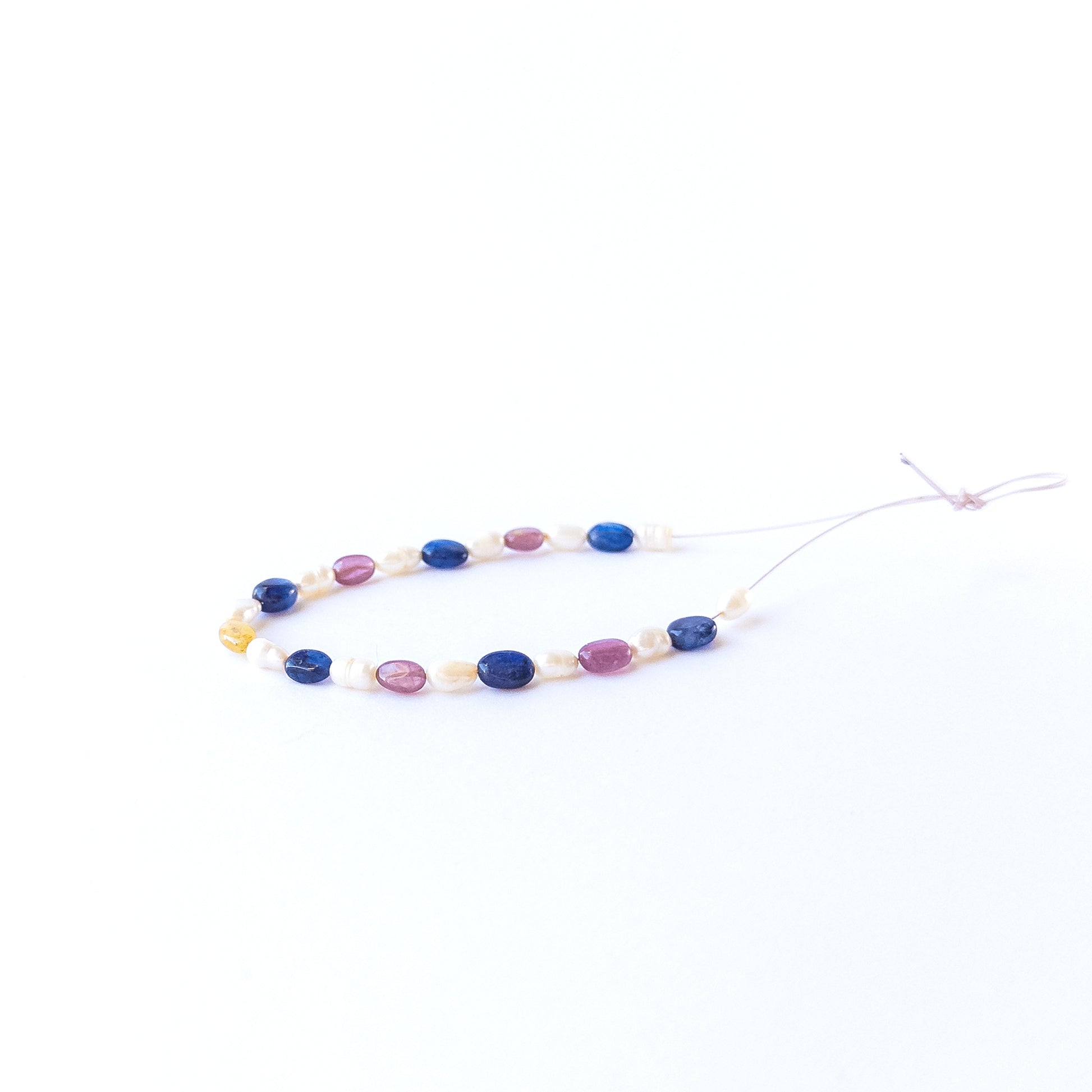 Authentic gemstone beads featuring Blue Sapphire, Ruby and pearls with smooth oval shine for DIY jewellery.