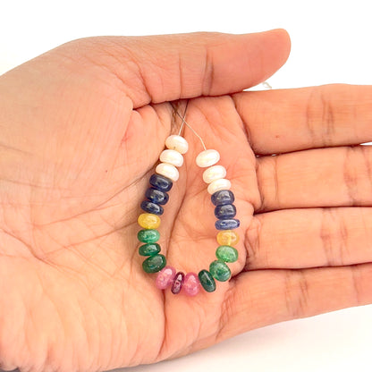 Close‑up of smooth rondelle freshwater pearls and multi precious beads 6.2–6.7mm showing polished surfaces and soft sheen.