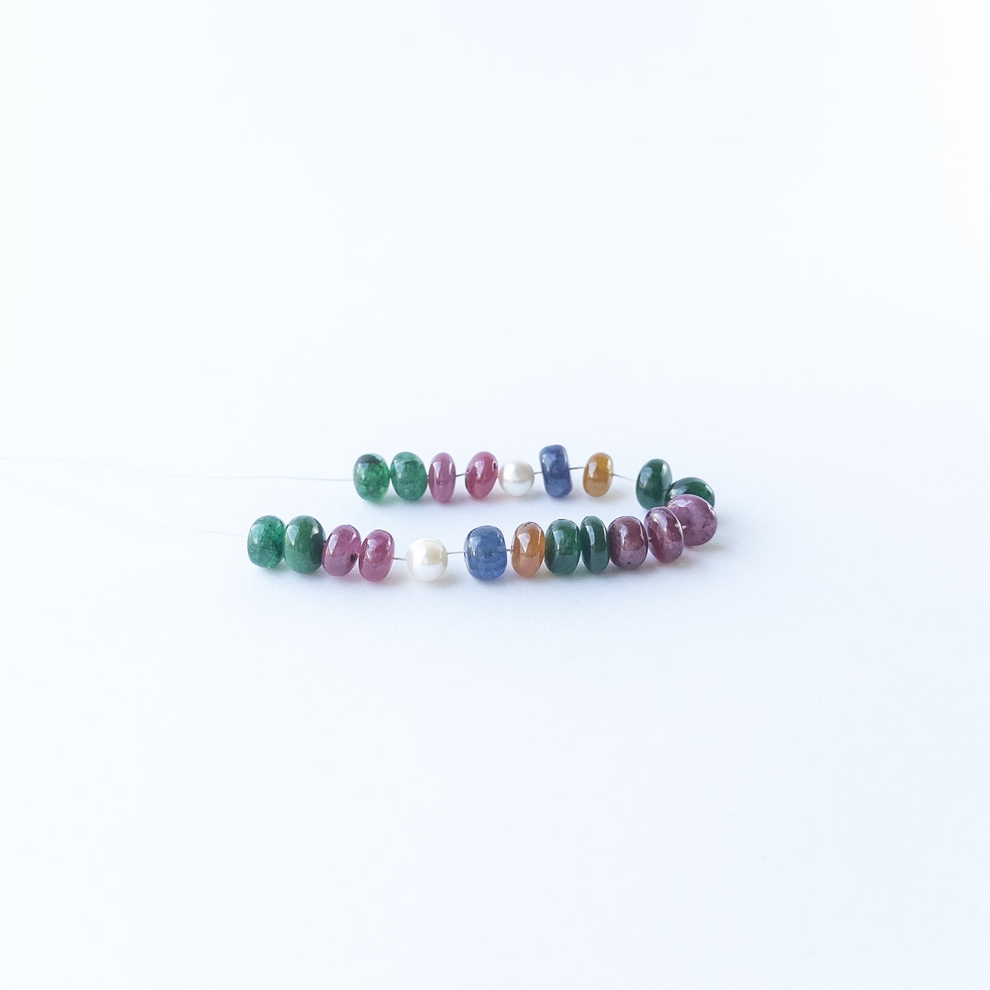 Smooth rondelle Ruby and Emerald beads with freshwater pearls ideal for handmade jewellery components.