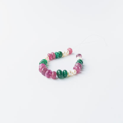 Authentic Ruby, Emerald and freshwater pearl rondelle beads showcasing polished shine for DIY jewellery.