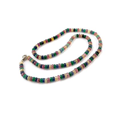 Close‑up of multi precious faceted rondelle beads highlighting their polished facets, colour depth and radiant shine.