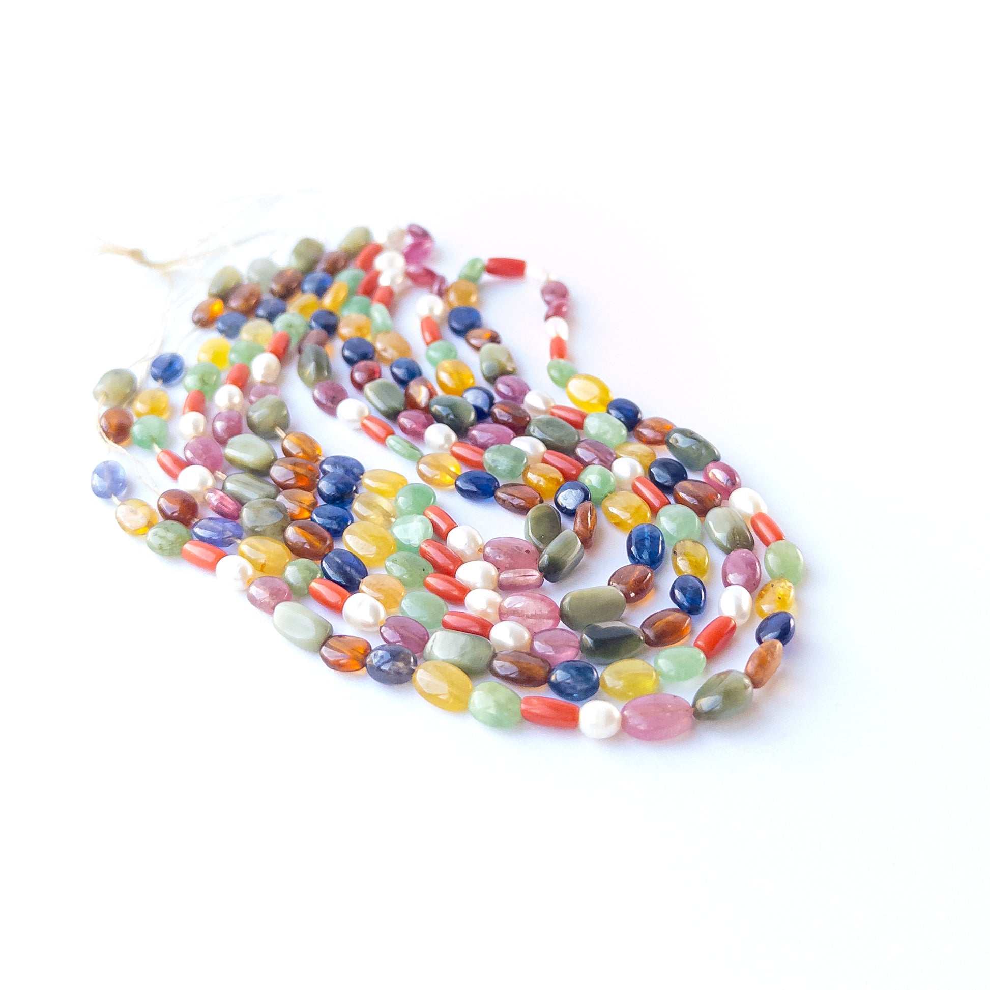 Navratan smooth oval beads displaying vibrant mixed colours and premium craftsmanship in a 41cm strand.