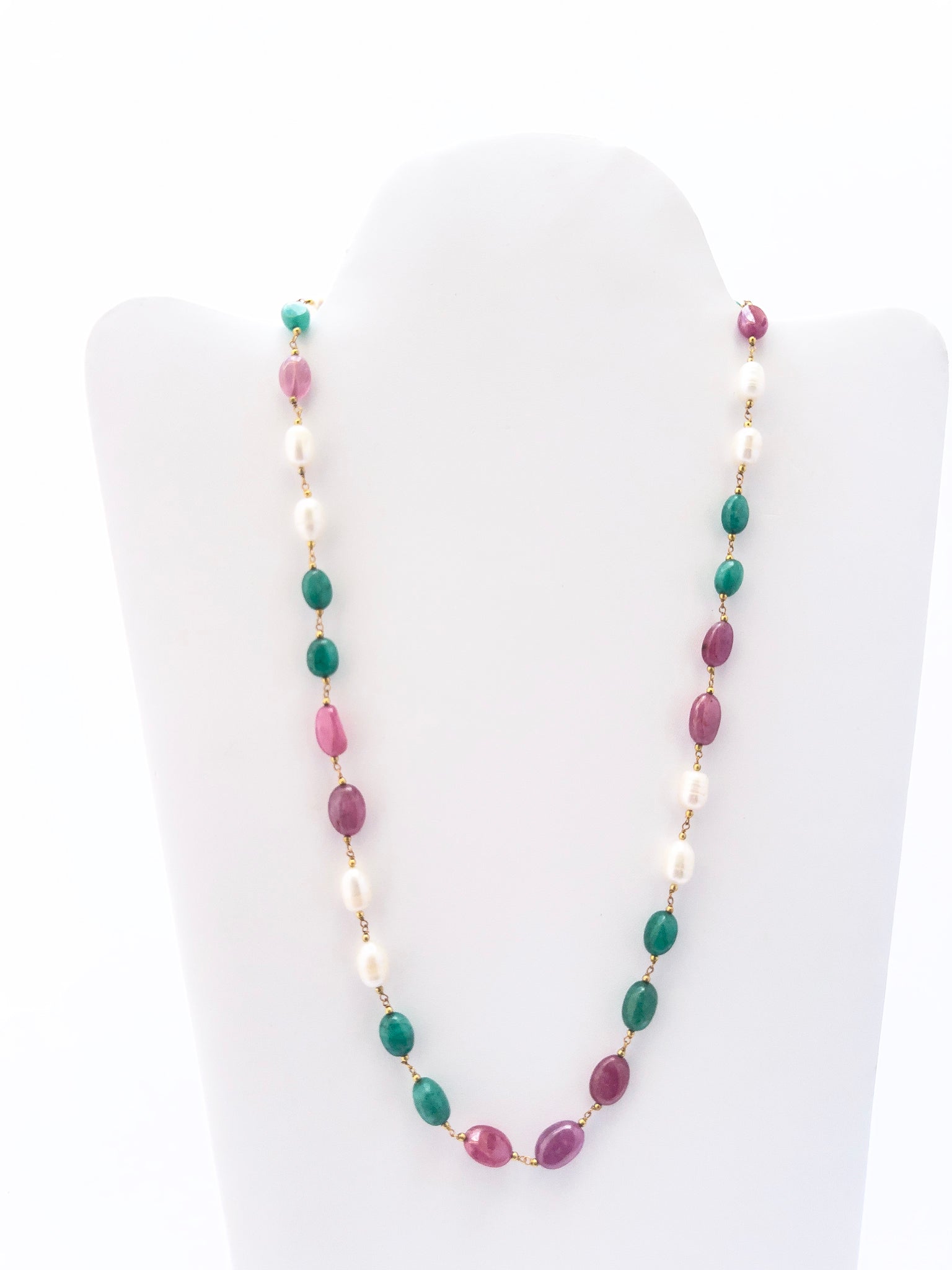 Necklace with multicolored beads on a white mannequin bust
