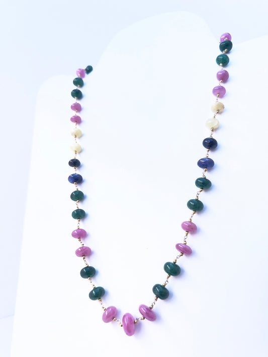 Artisan-crafted necklace combining gemstones in radiant hues, adjustable strand length.