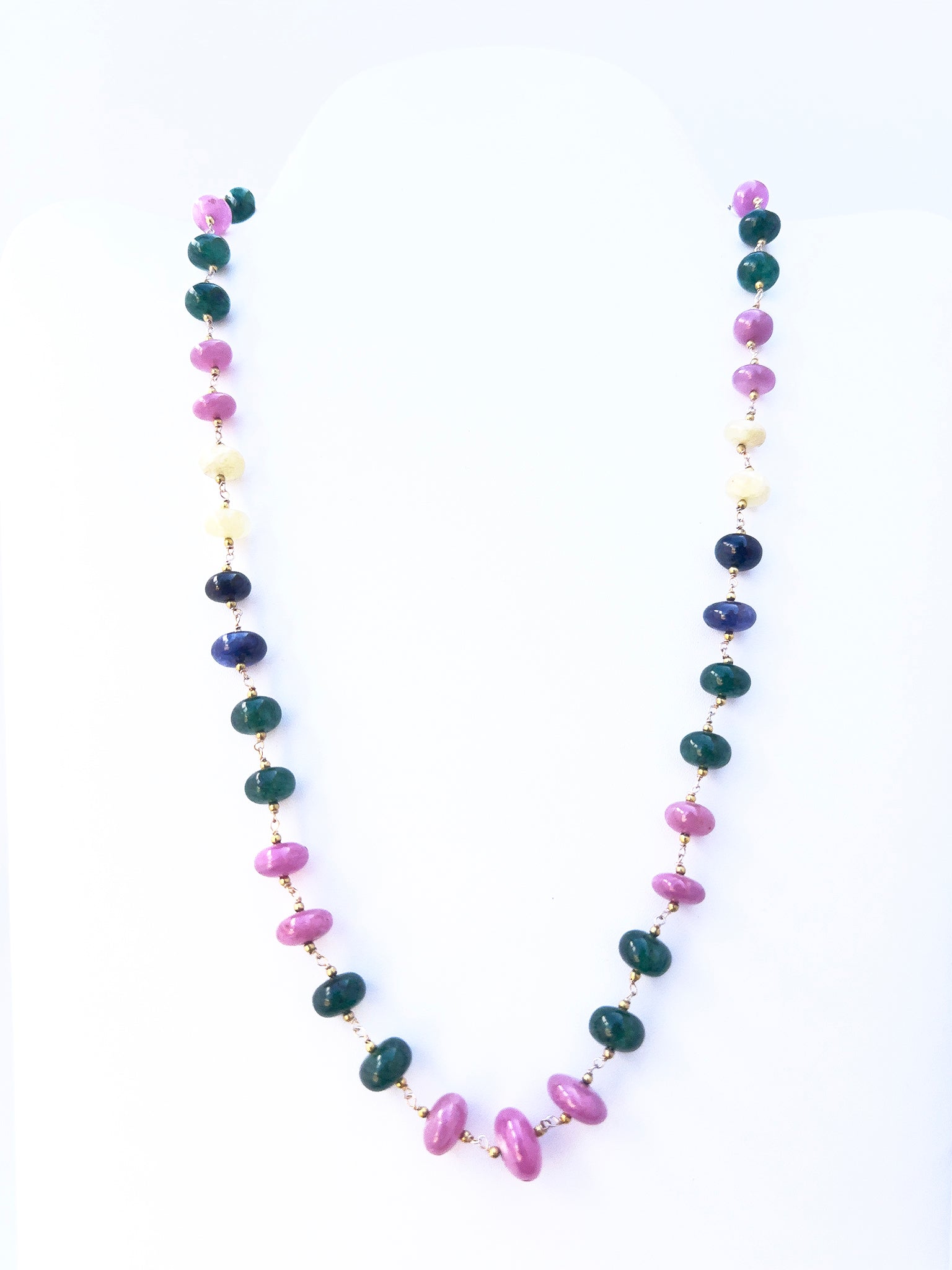 Ruby and Emerald beads paired with sapphires, arranged in a polished single strand design.