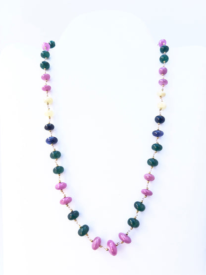 Ruby and Emerald beads paired with sapphires, arranged in a polished single strand design.