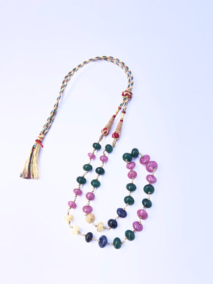 Detailed view of multi precious rondelle beads, polished finish, vibrant gemstone colours.