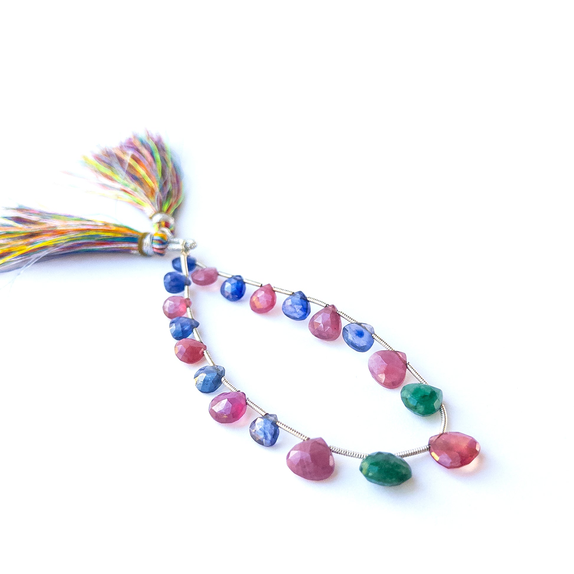 Authentic multi precious briolette stones showcasing rich red, blue and green tones for jewellery making.