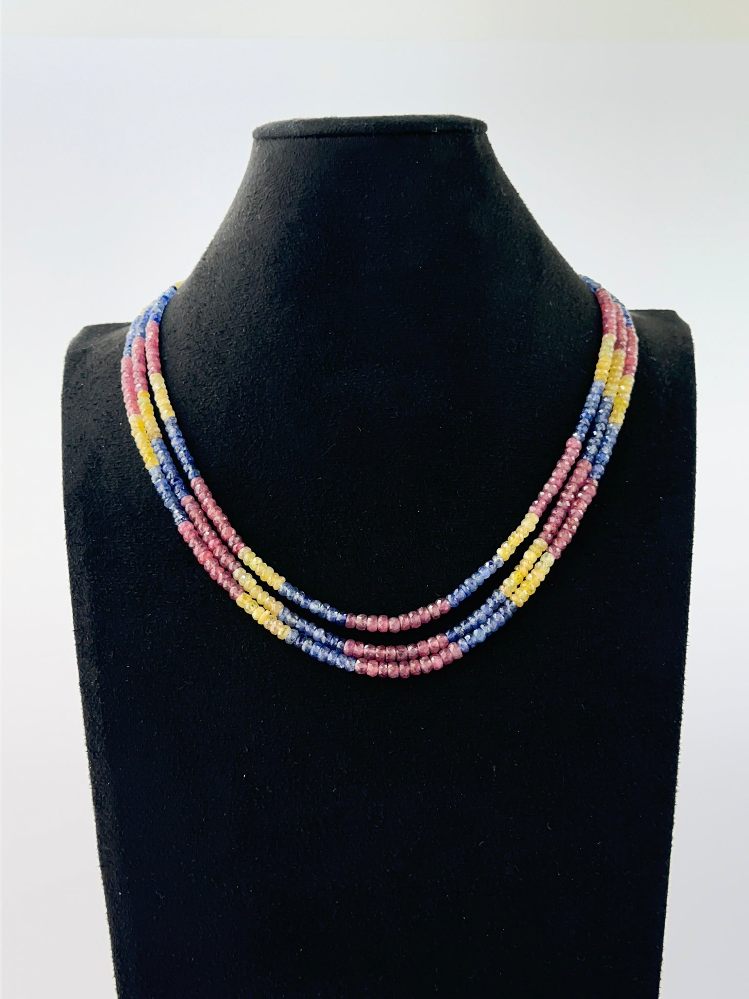Elegant triple‑strand multi‑precious necklace showcasing faceted 4–4.5mm rondelle beads.