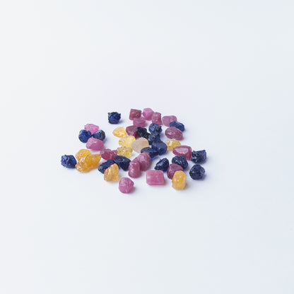 Genuine Ruby, Blue Sapphire and Yellow Sapphire rough stones in 6–7mm size with raw texture.