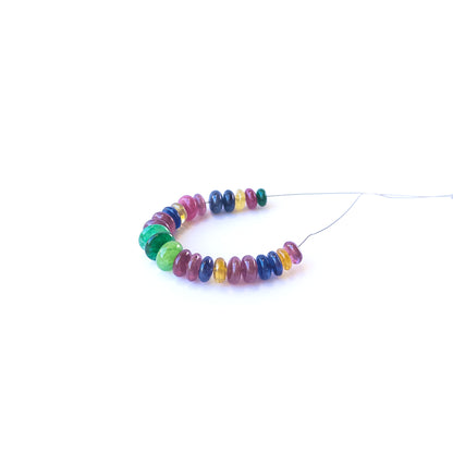 Authentic multi‑precious rondelle gemstone beads in rich red, green and blue hues for DIY jewellery making.