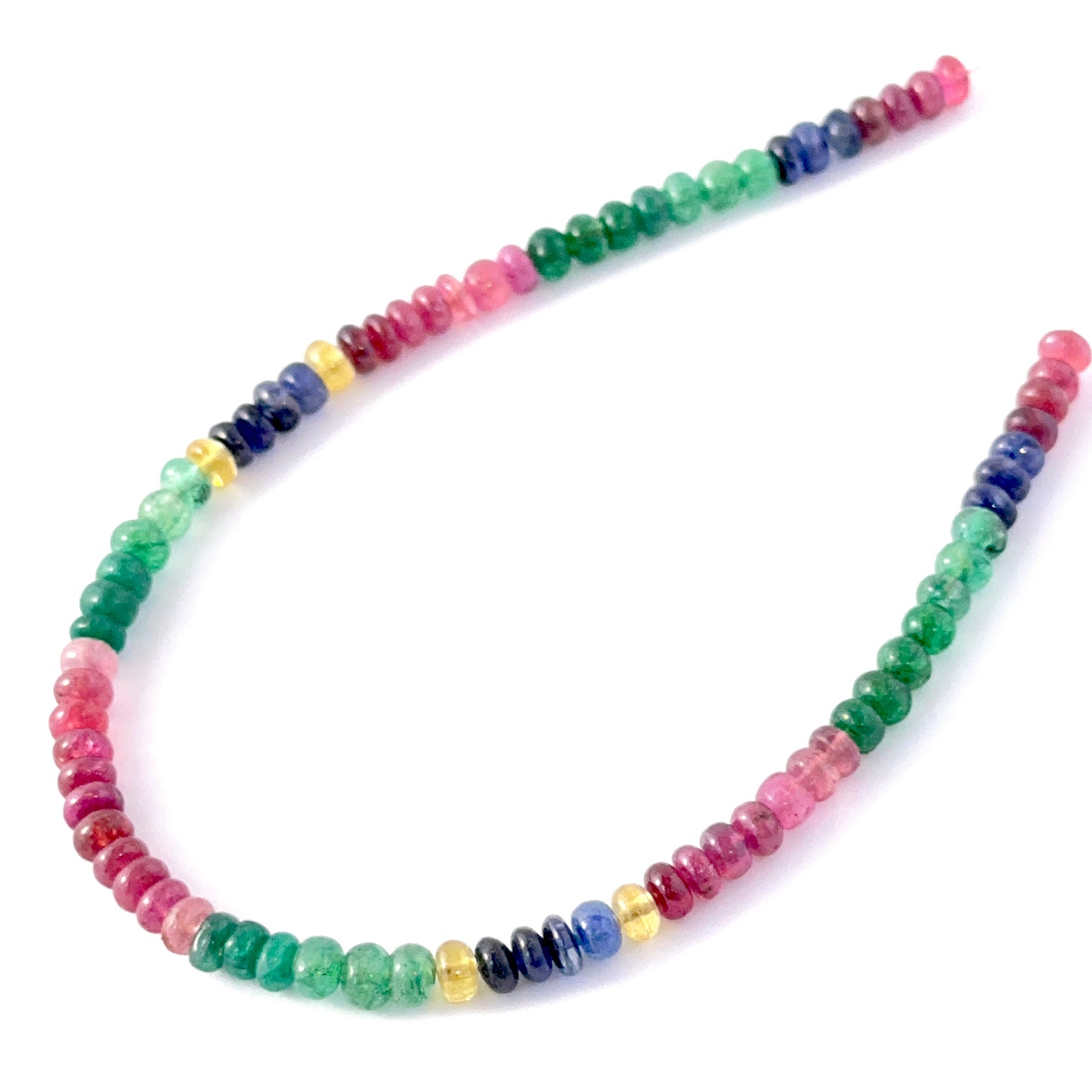 Multi Precious rondelle beads showing polished surfaces and vibrant mixed gemstone colours.