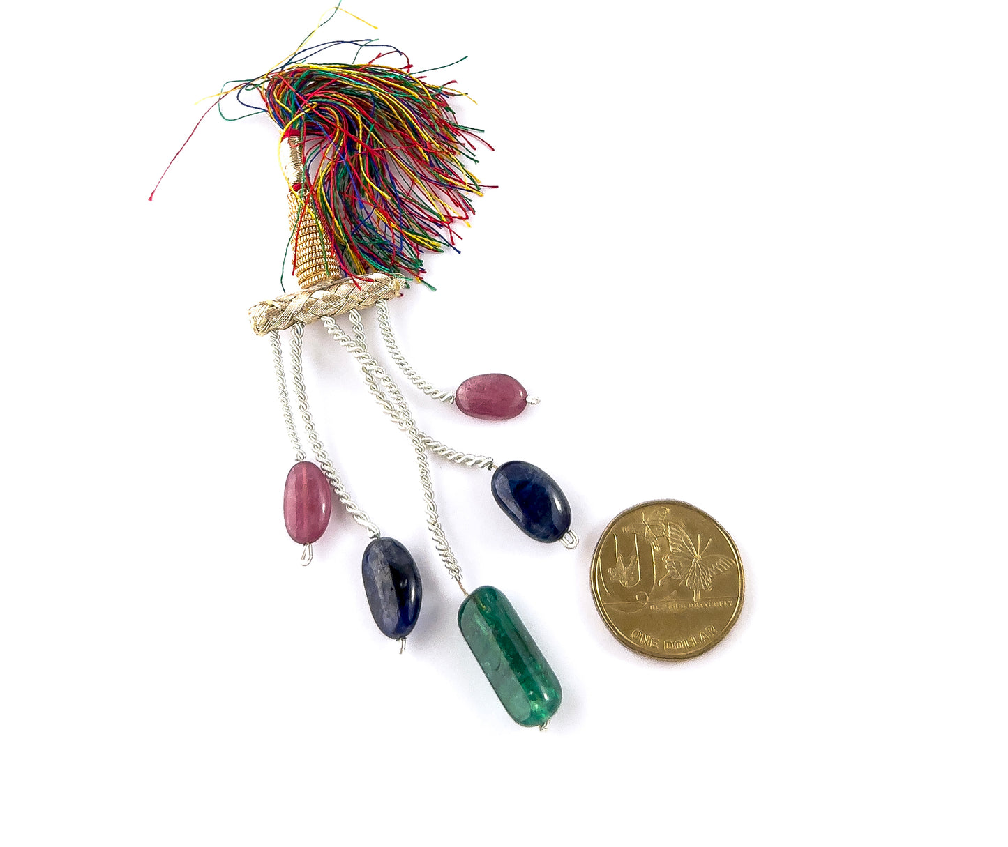 A coin is placed near multi precious tumbled stones to show the 10–13mm size range.