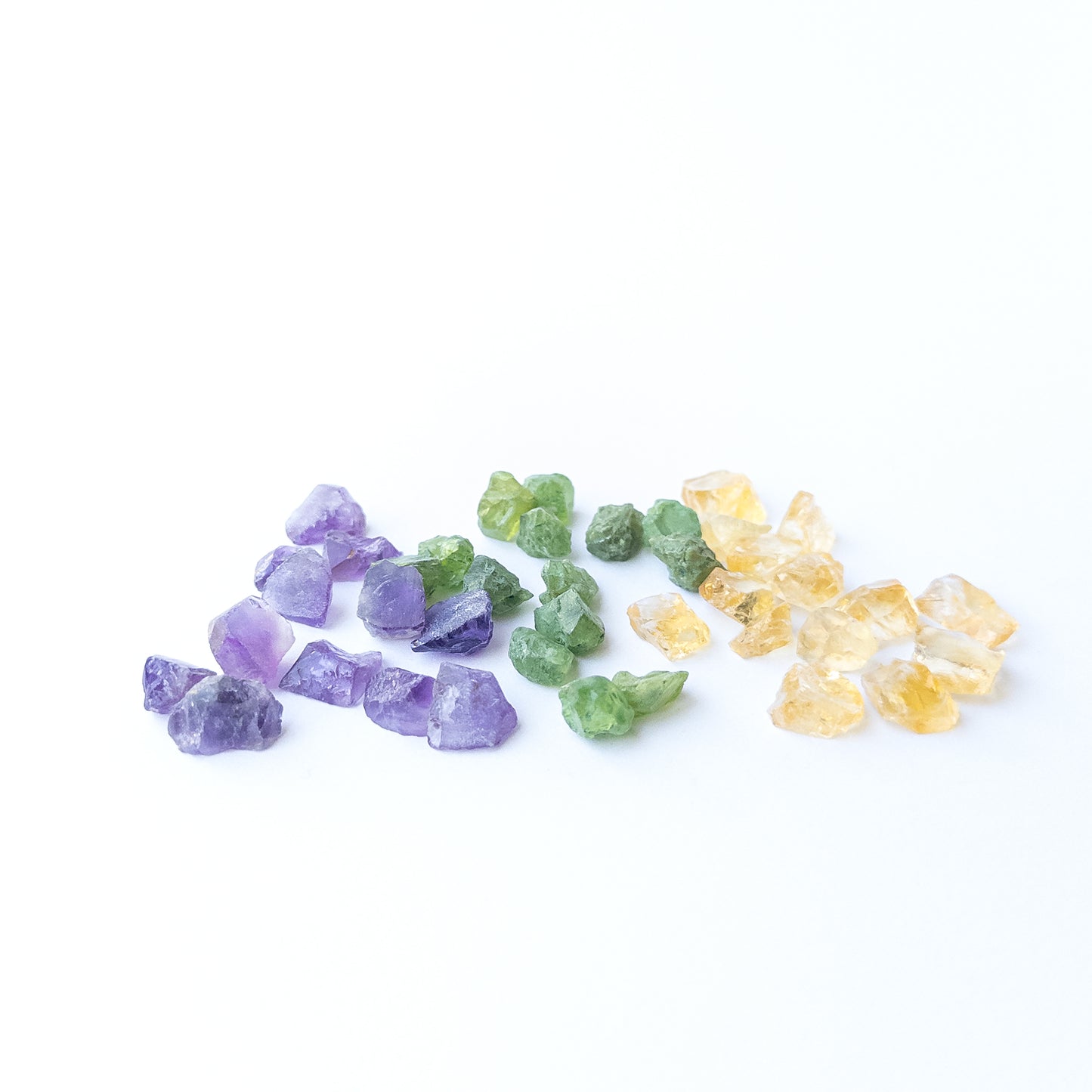 Vibrant Amethyst, Citrine and Peridot rough stones with natural sparkle and earthy raw finish.