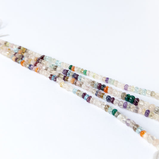 Multi stone carved pumpkin beads arranged on a 20cm strand for handmade jewellery components.