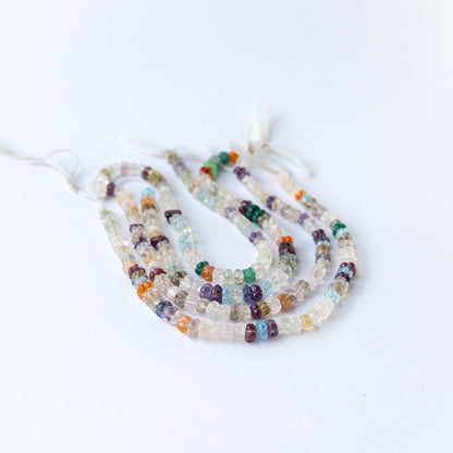 Genuine multi stone beads in carved pumpkin shape showcasing natural colours and smooth polish.