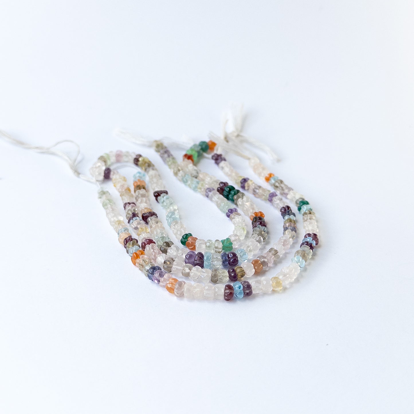 Authentic carved pumpkin gemstone beads with mixed tones ideal for DIY jewellery making.