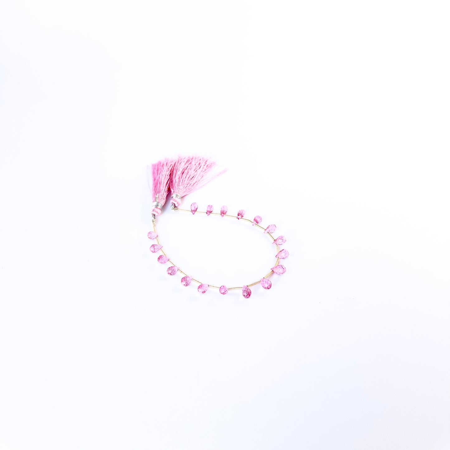 Pink Topaz faceted briolette beads showing vibrant pink colour and sparkling cut, ideal for handmade jewellery components.