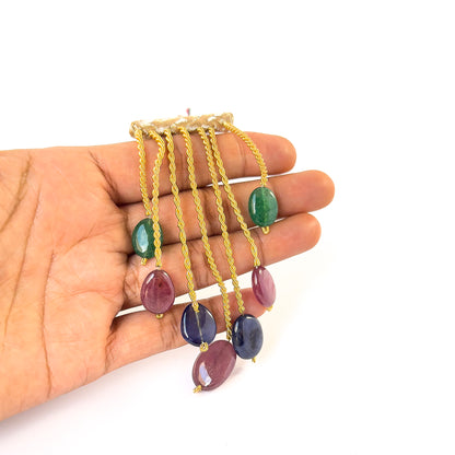 Smooth oval Emerald, Ruby and Sapphire beads aligned in a set, ideal for gemstone beadwork and artisan designs.