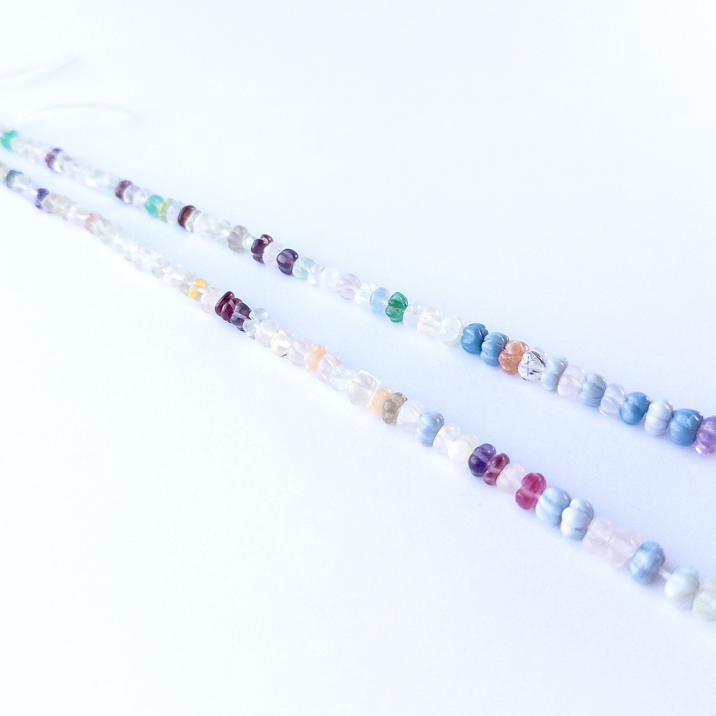 Handmade jewellery components featuring multi‑stone pumpkin cut beads with soothing and vibrant natural hues.