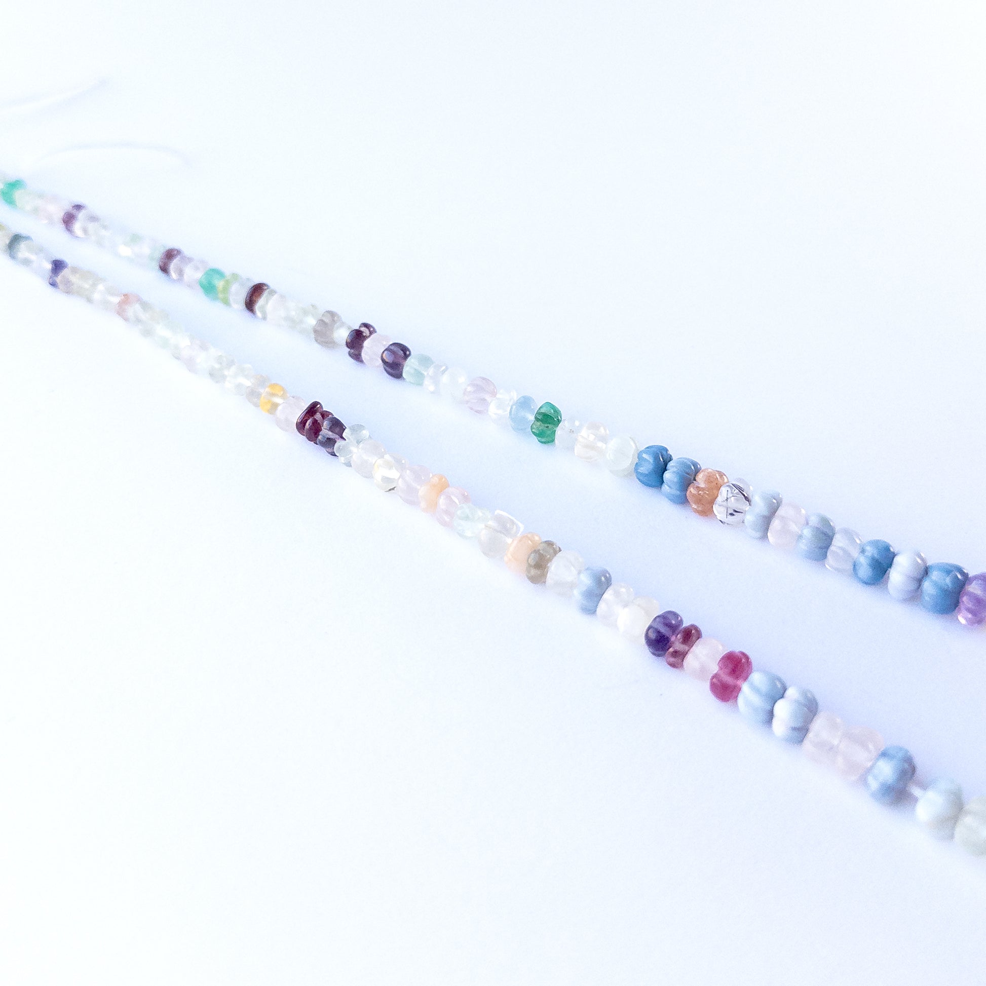 Handmade jewellery components featuring multi‑stone pumpkin cut beads with soothing and vibrant natural hues.