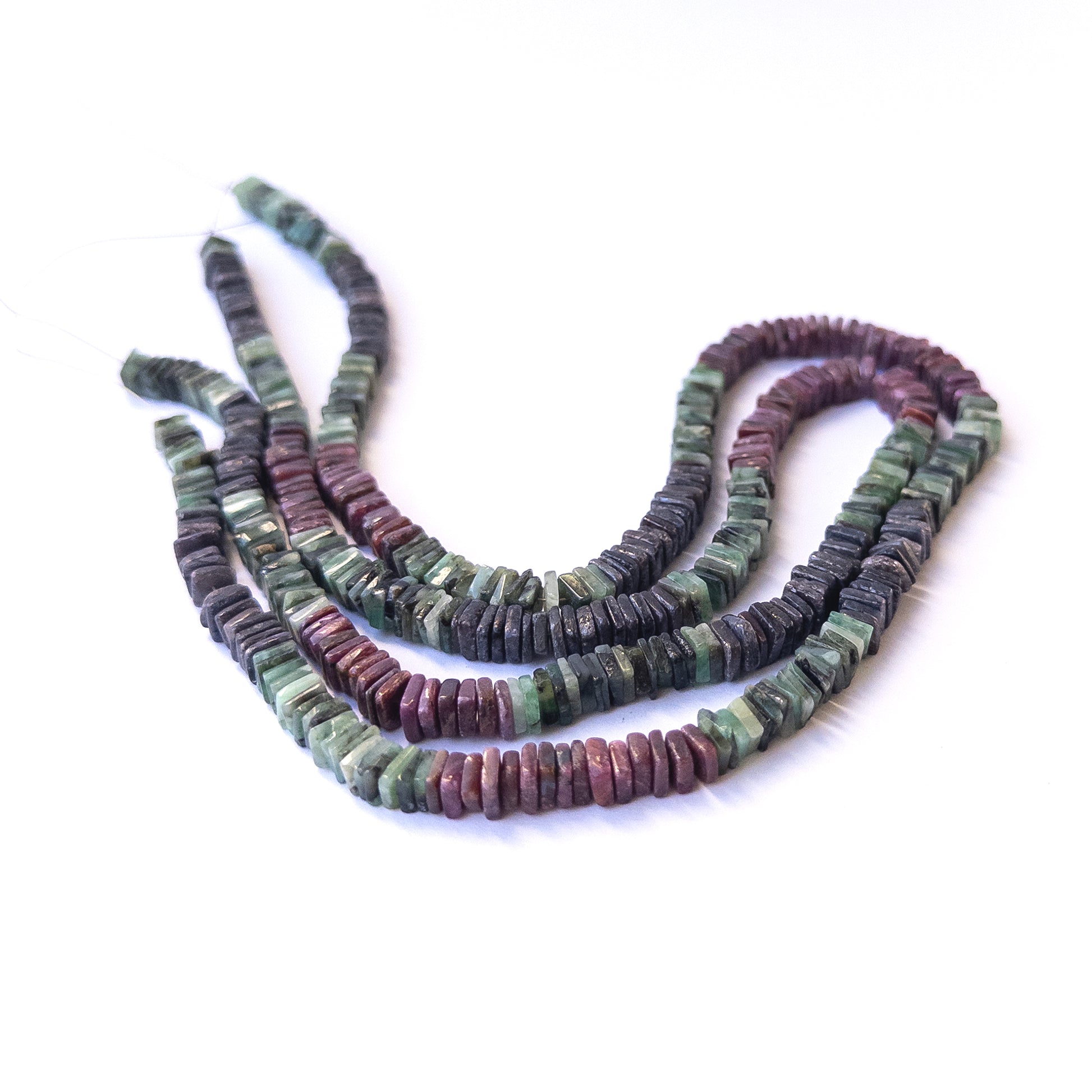 Authentic multi‑stone gemstone beads featuring rich red, blue and green tones in smooth square heishi cut.