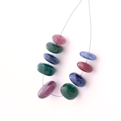 Set of 9 multi stone smooth rondelle beads 9–15mm totalling 82 carats, ideal for bespoke jewellery settings.