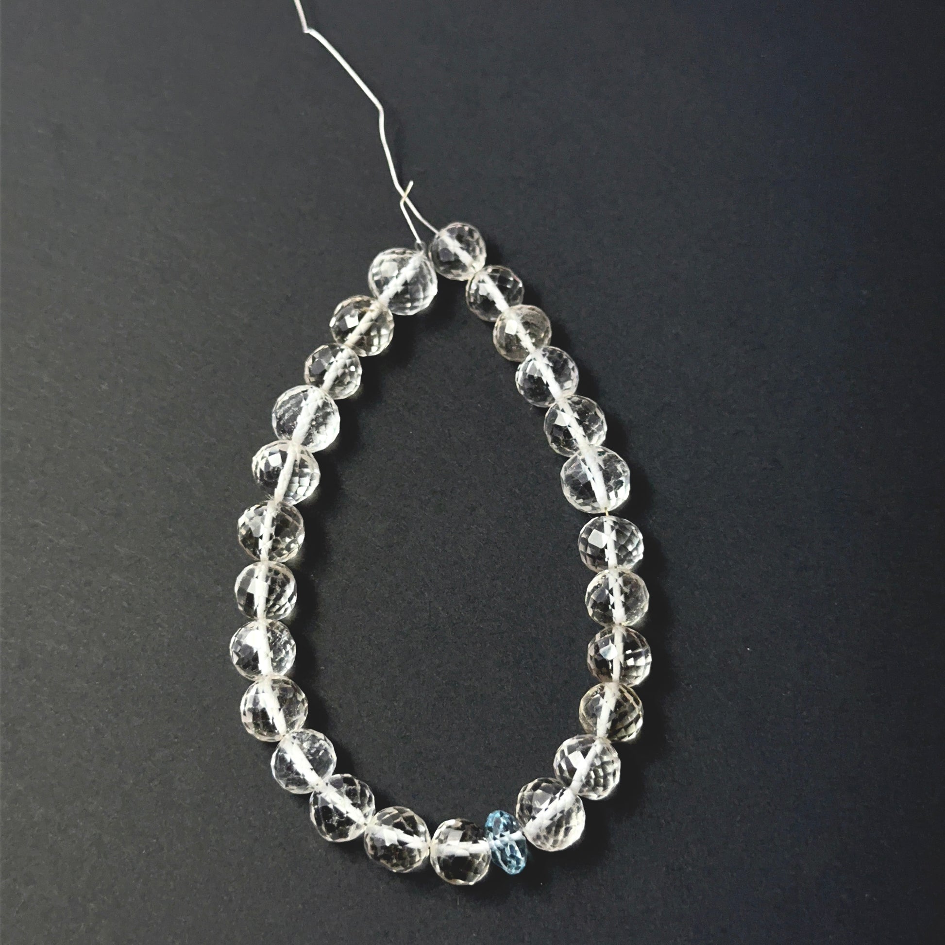 Soft pink rose quartz and cool aquamarine faceted round beads, 7–8mm, arranged in a 25‑piece set for handmade jewellery components.