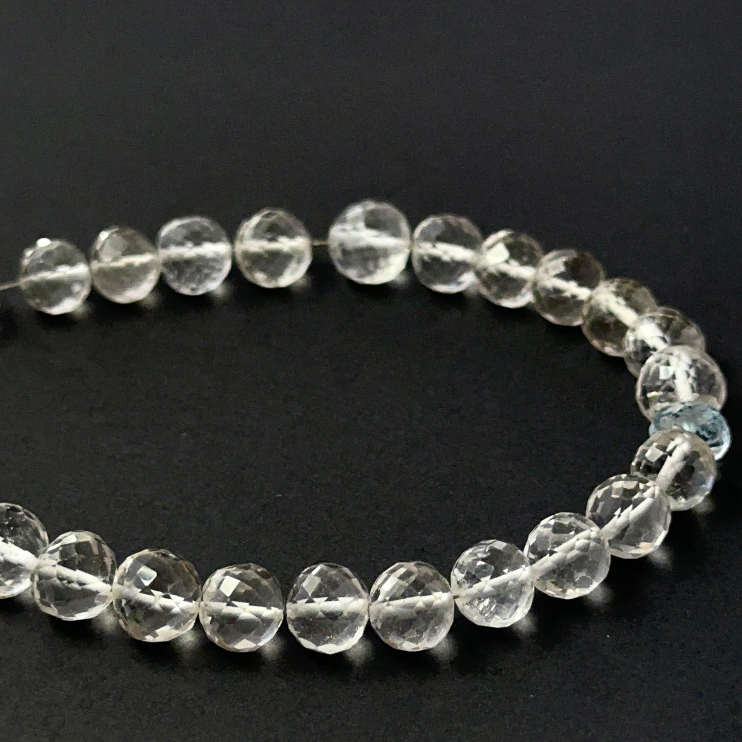 Rose quartz and aquamarine faceted round beads with glossy sparkle, perfect for elegant handmade jewellery designs.