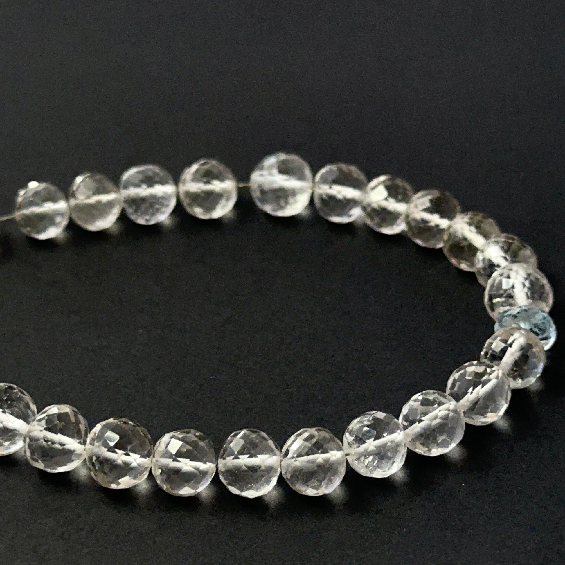 Rose quartz and aquamarine faceted round beads with glossy sparkle, perfect for elegant handmade jewellery designs.