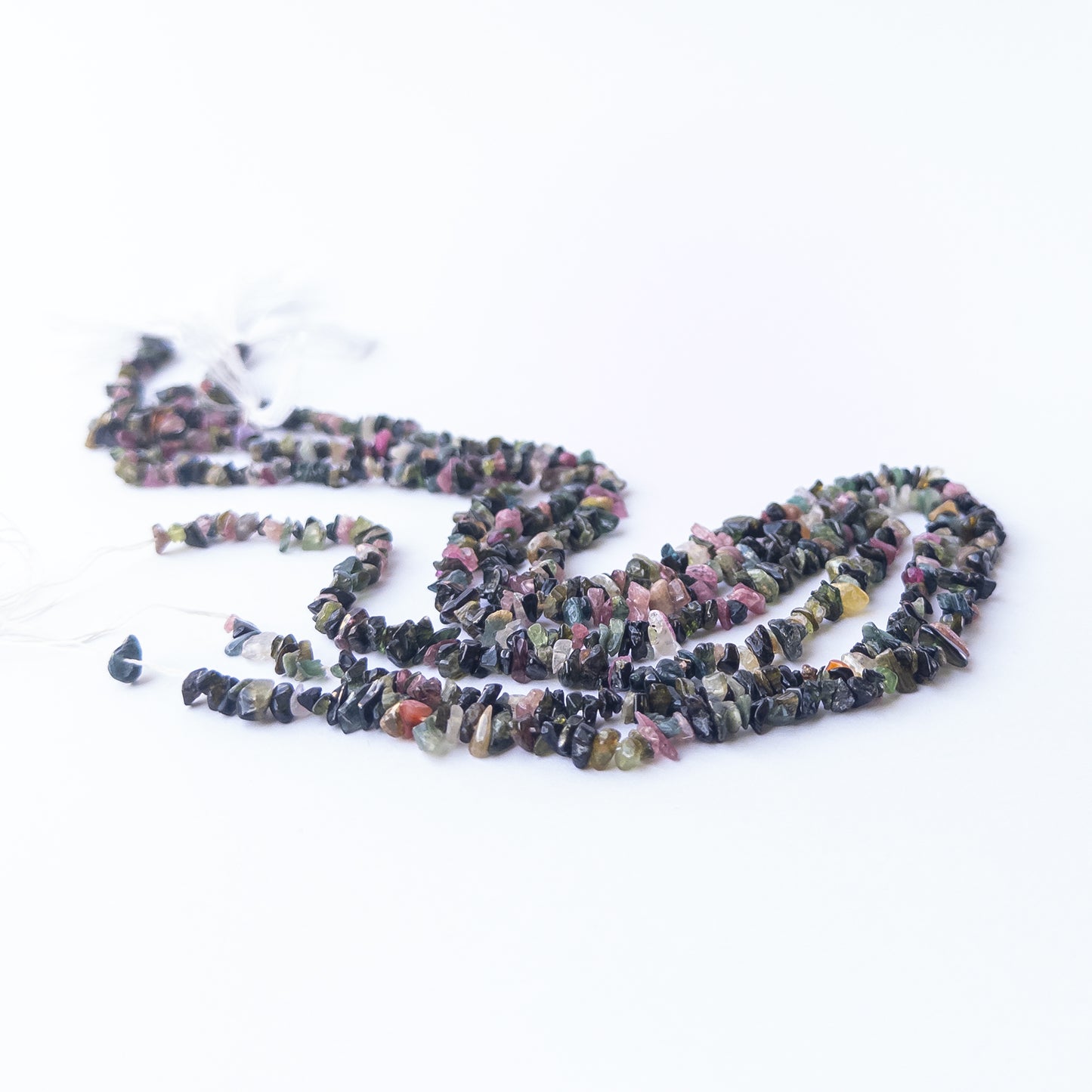 Multi Tourmaline chips and nuggets displaying vibrant colours and natural texture in a detailed strand.