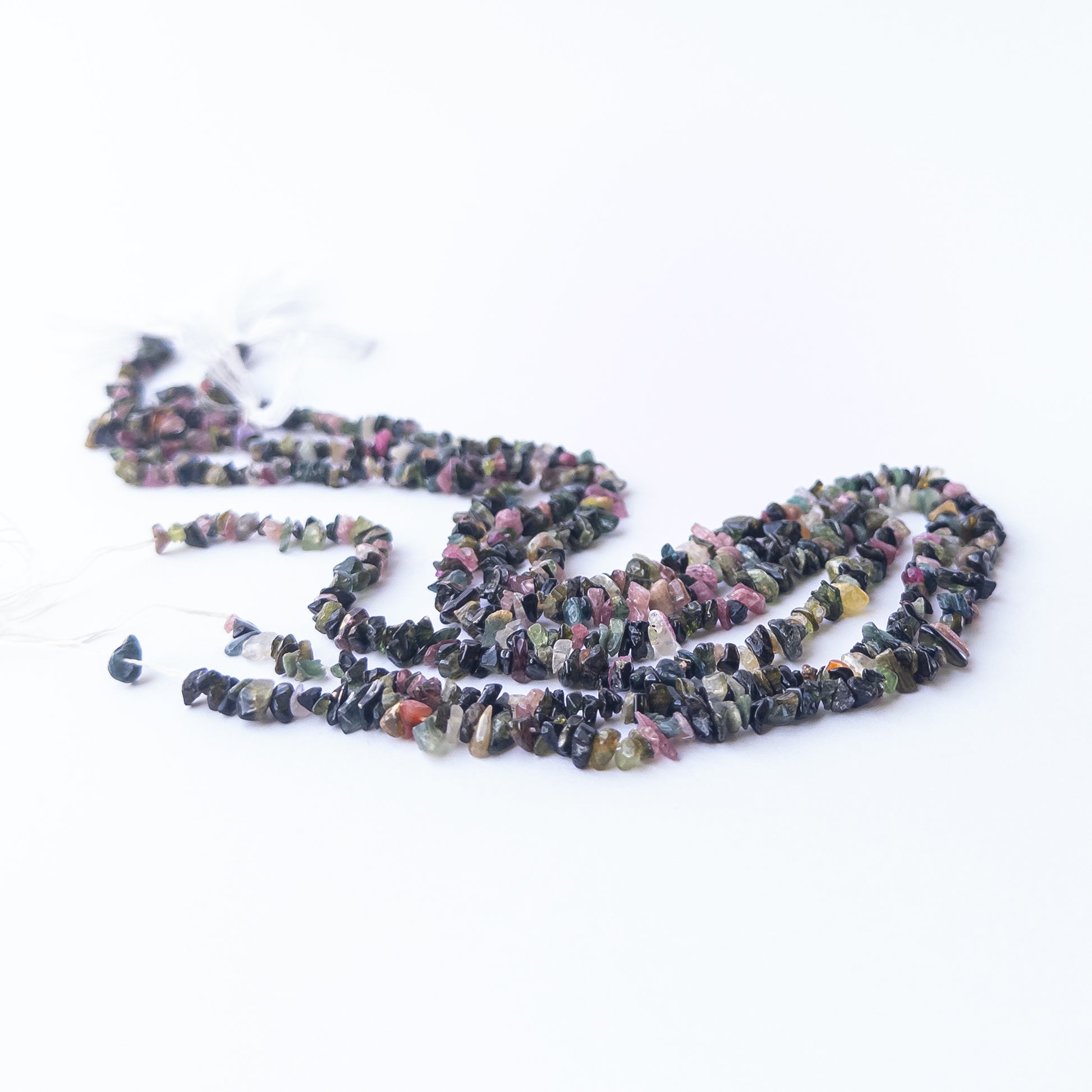 Multi Tourmaline chips and nuggets displaying vibrant colours and natural texture in a detailed strand.